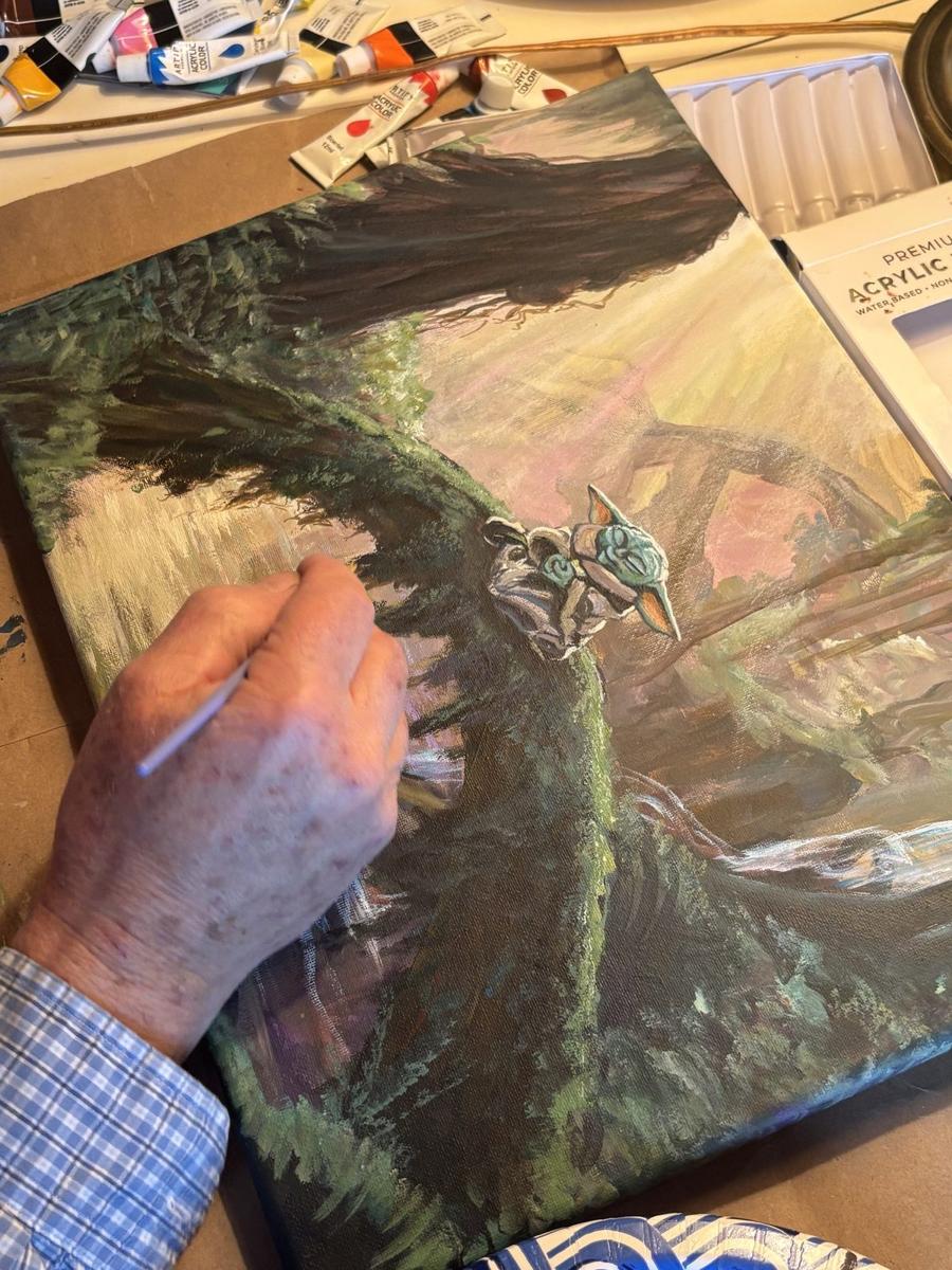 Tom Goetz hand-painting Force in the Forest in his South Florida studio